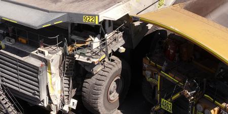 Two haul trucks colliding