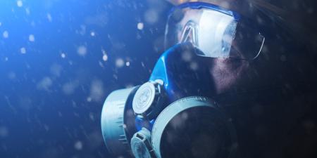 Person wearing breathing apparatus and goggles